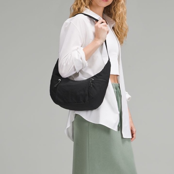 lululemon athletica Handbags - Lululemon slouchy sling bag 6l black color